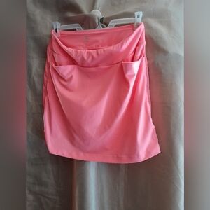 Tail golf skort size small.  Orange color.  Pockets on each side.